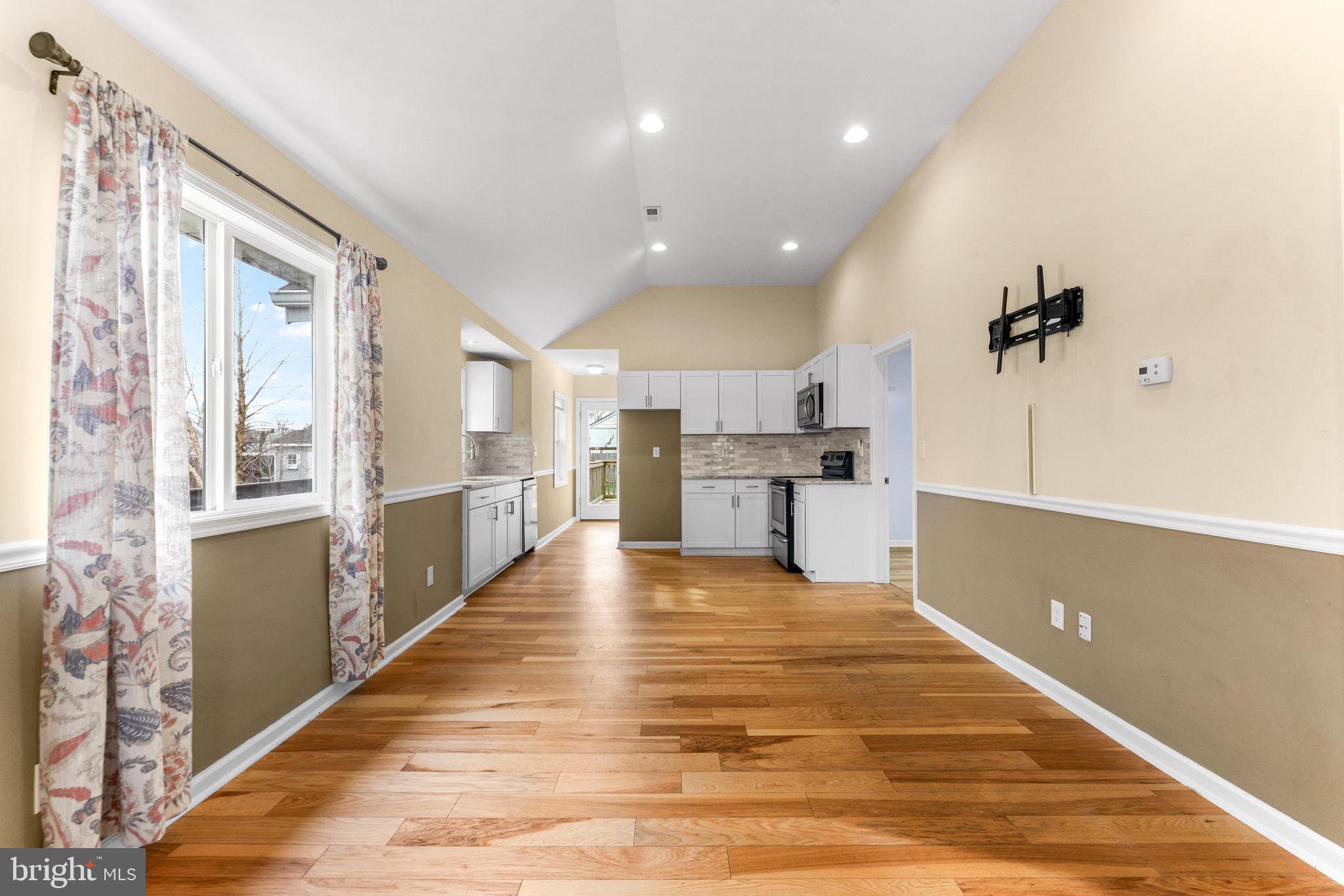 7343 Greenbank Road Baltimore, MD 21220 - Photo 7 of 46 a view of a kitchen with kitchen island a sink stainless steel appliances and cabinets