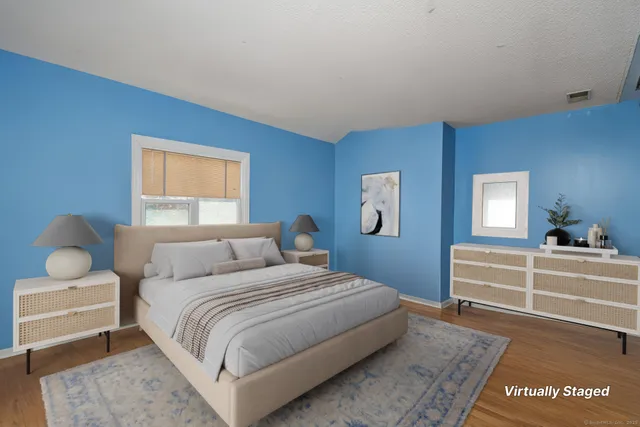 a very nice looking room with many windows and furniture