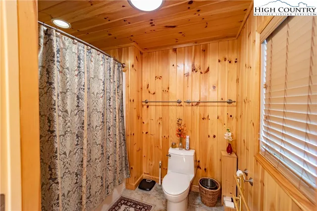 a view of a livingroom with furniture and a fireplace