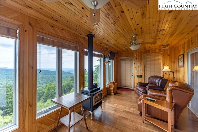 a aerial view of a house with a yard table and chairs