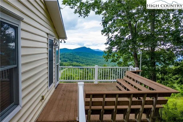 a kitchen with stainless steel appliances granite countertop a sink and wooden cabinets