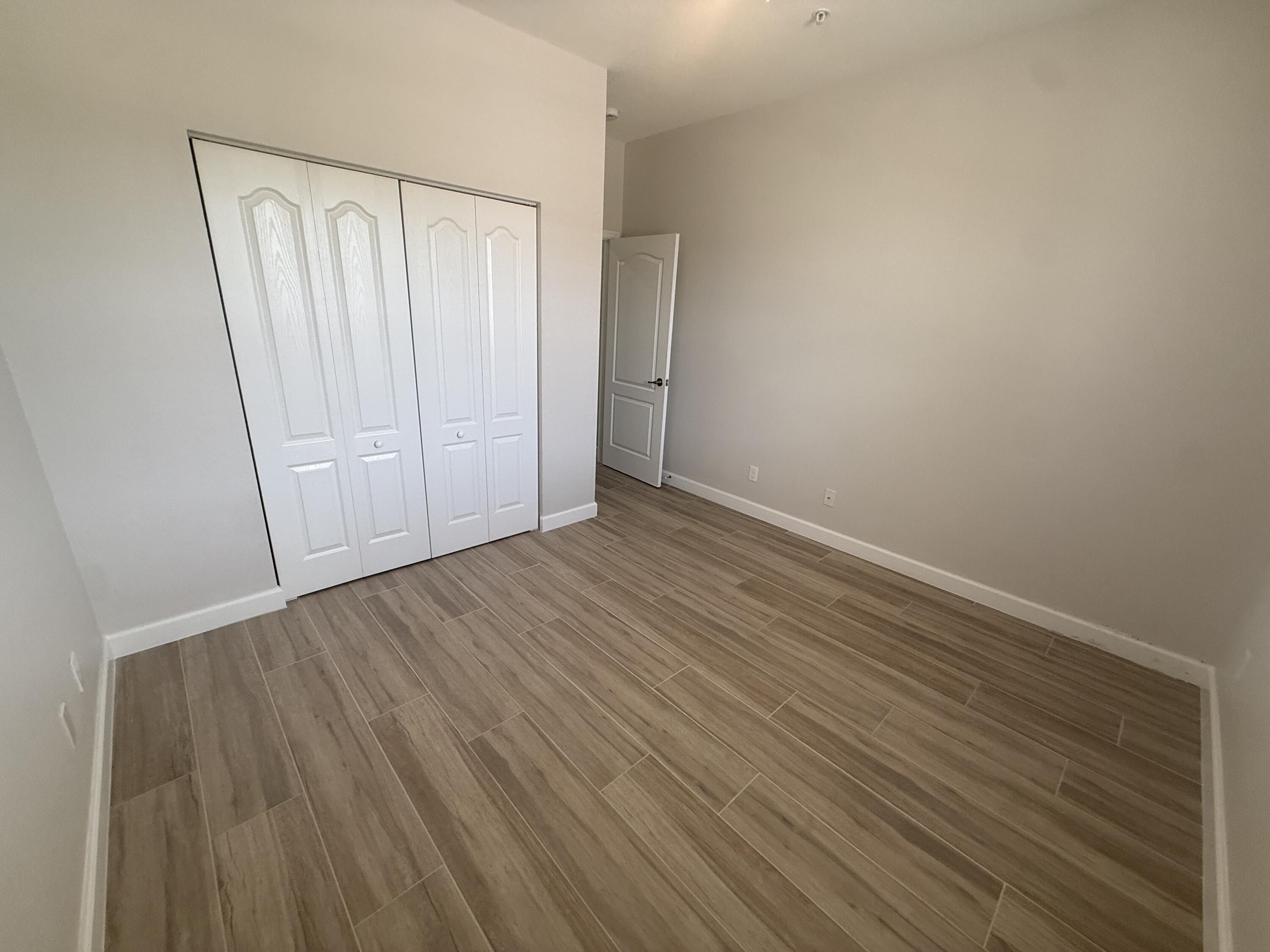 9519 Southwest Merlin Court Stuart, FL 34997 - Photo 16 of 26 Guest bedroom 1