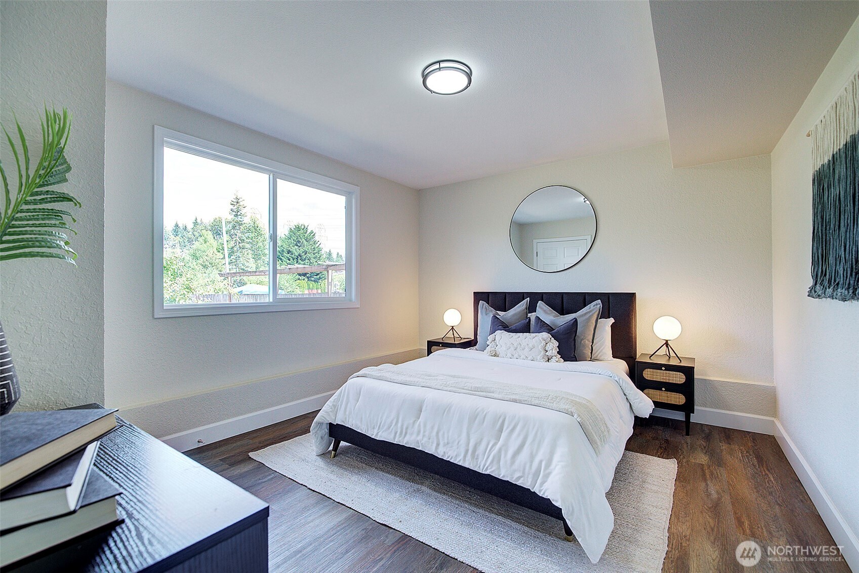 2019 181st Street Southeast Bothell, WA 98012 - Photo 16 of 23 a bedroom with a bed and window