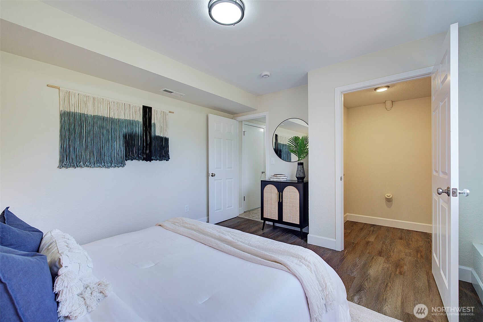 2019 181st Street Southeast Bothell, WA 98012 - Photo 17 of 23 a bedroom with a bed and a television