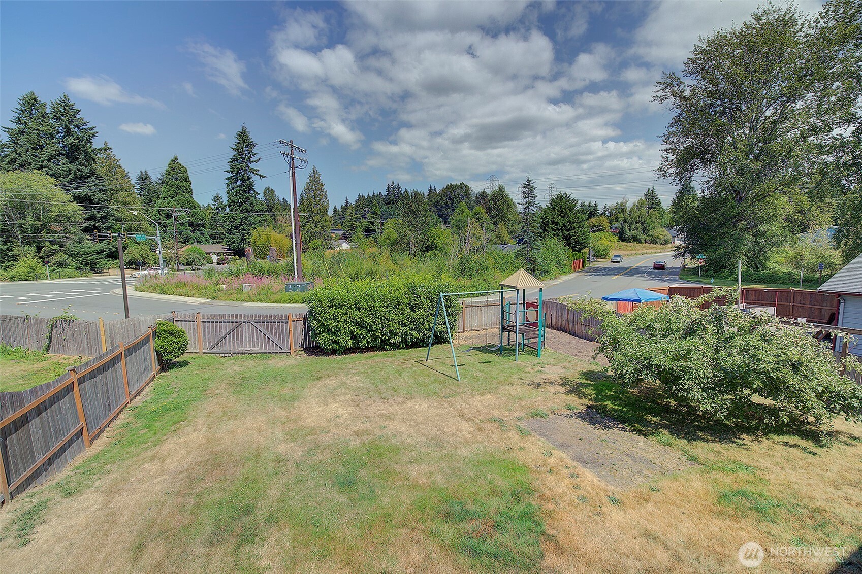 2019 181st Street Southeast Bothell, WA 98012 - Photo 21 of 23 a view of a garden with large trees