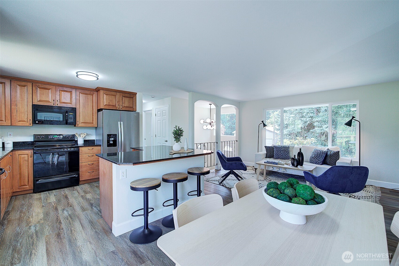 2019 181st Street Southeast Bothell, WA 98012 - Photo 10 of 23 a large living room with stainless steel appliances kitchen island furniture and a large window