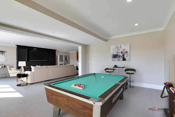 a room with furniture pool and flat screen tv