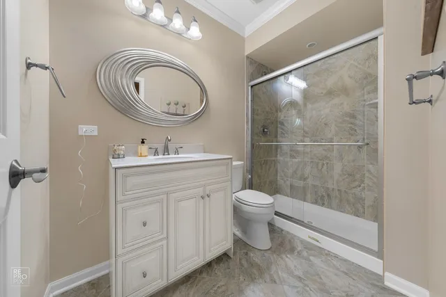 a bathroom with a toilet a sink and a mirror