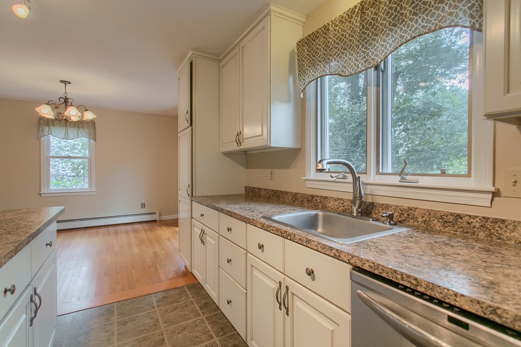 171 Northwest Road Spencer, MA 01562 - Photo 12 of 30 a kitchen with granite countertop a sink and a window
