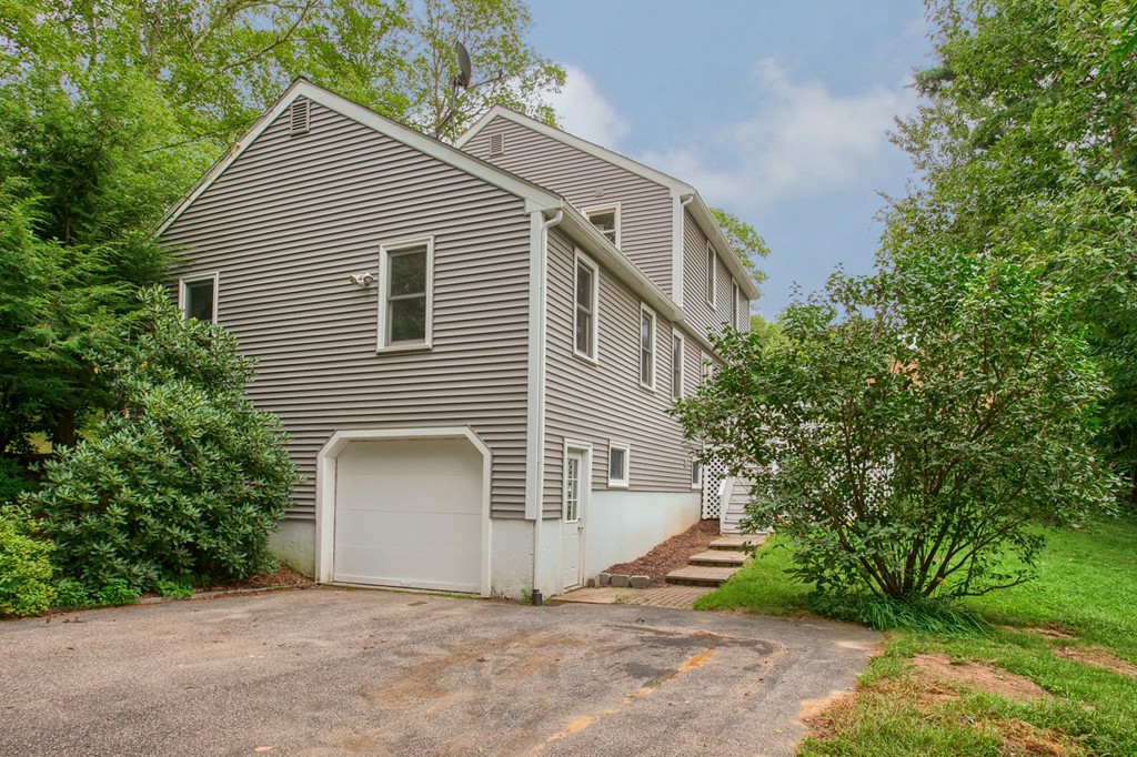 171 Northwest Road Spencer, MA 01562 - Photo 26 of 30 a view of a house with a yard and garage