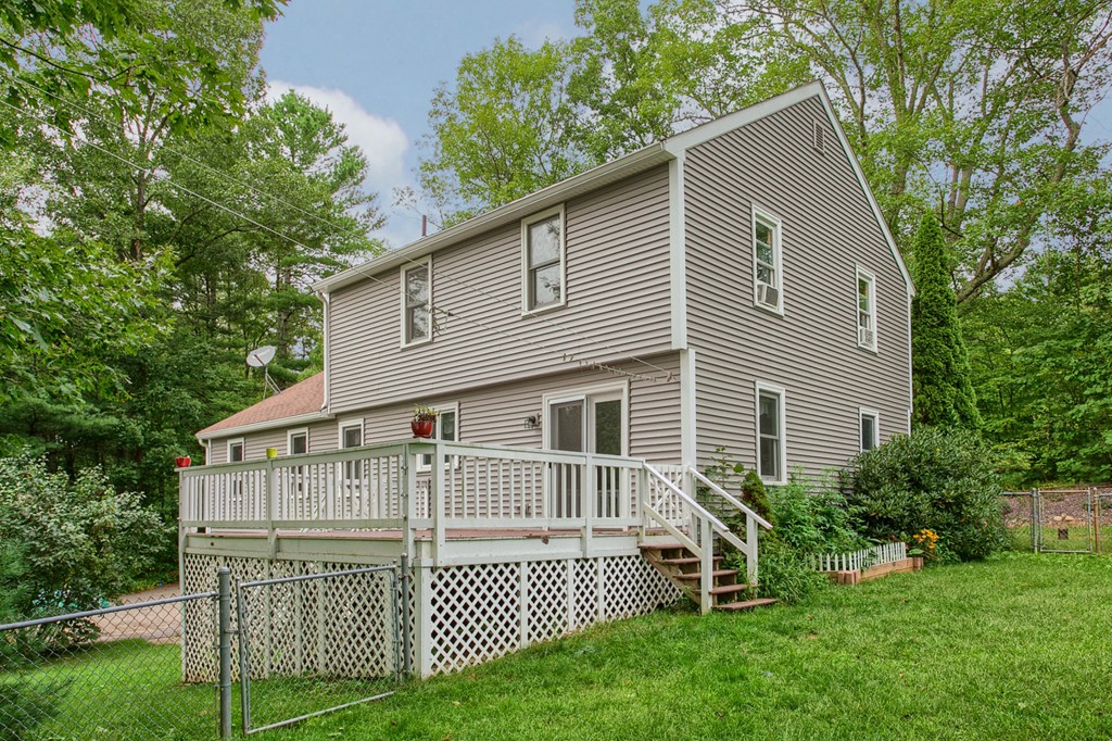 171 Northwest Road Spencer, MA 01562 - Photo 27 of 30 a view of a house with a yard and plants