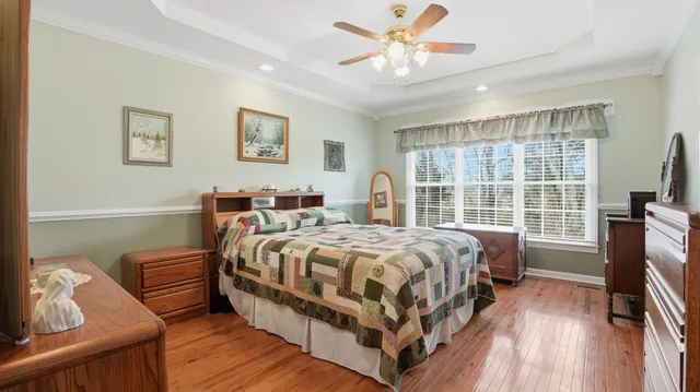 a bed room with a bed and a tv