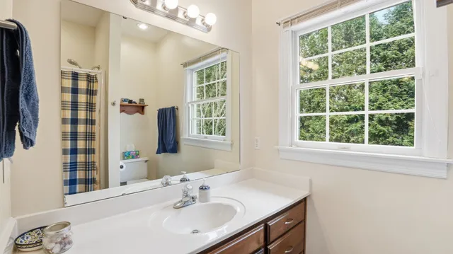 a bathroom with a sink double vanity and shower