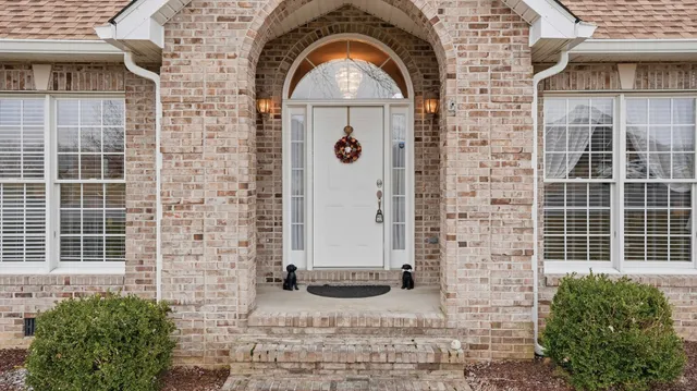 a view of a brick house with windows