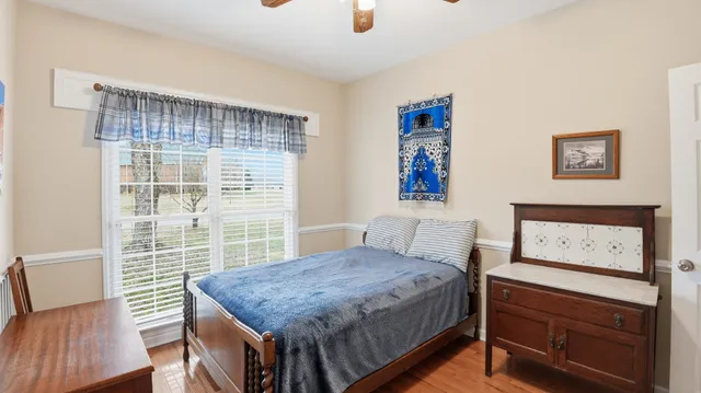 a bedroom with a bed and a table in it