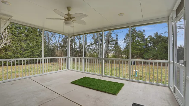 a view of a balcony with furniture