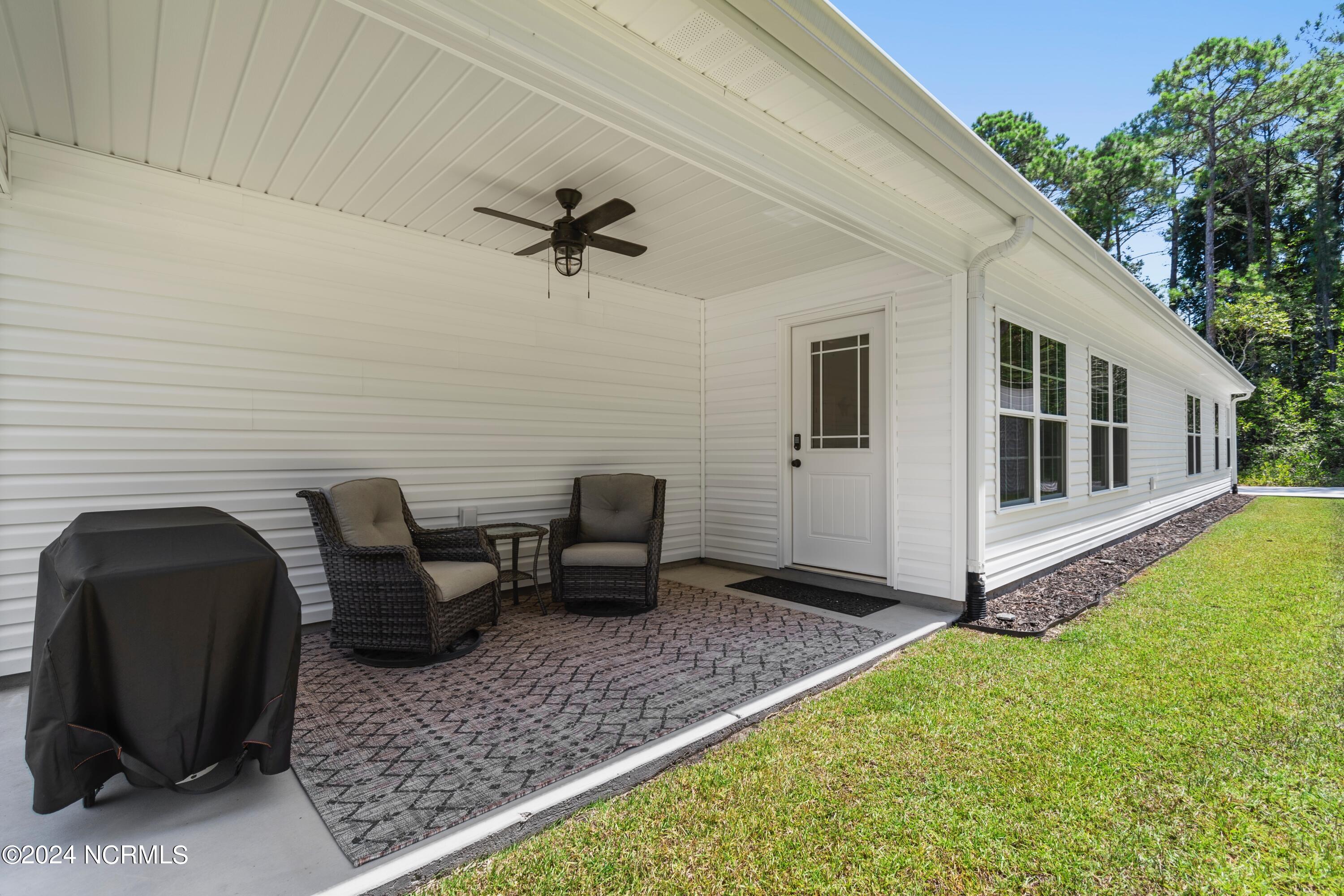 185 Boundary Loop Road Northwest Calabash, NC 28467 - Photo 34 of 56 Covered porch