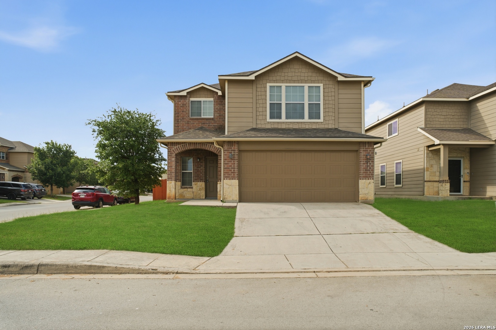 403 Walnut Crest Schertz, TX 78154 - Photo 2 of 30 a front view of a house with a yard and garage
