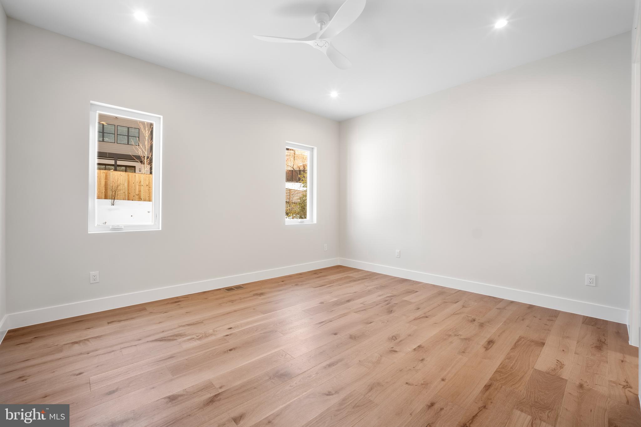 1935 Foxhall Road McLean, VA 22101 - Photo 19 of 80 an empty room with wooden floor and windows