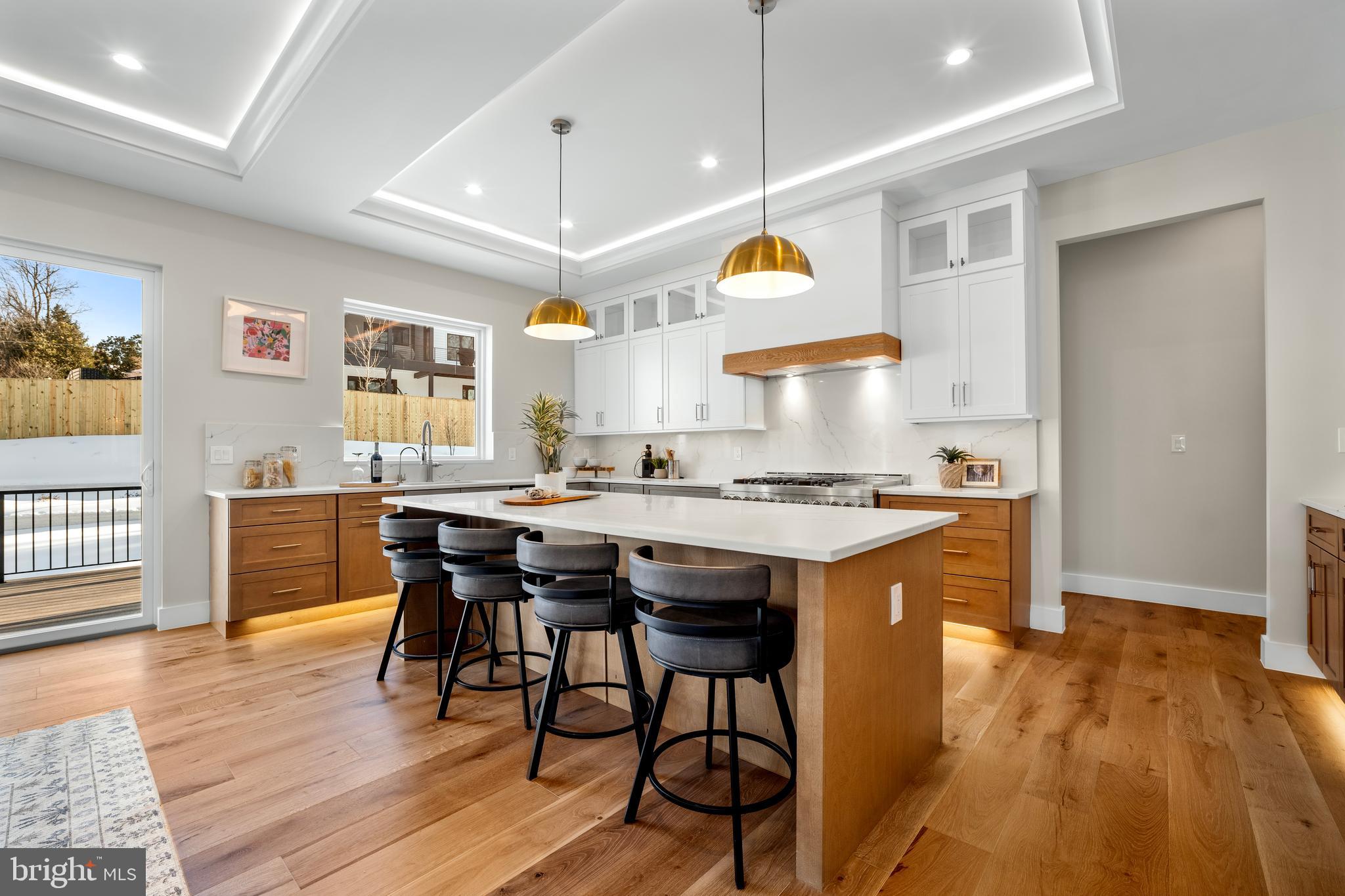 1935 Foxhall Road McLean, VA 22101 - Photo 32 of 80 a large kitchen with a table and chairs in it