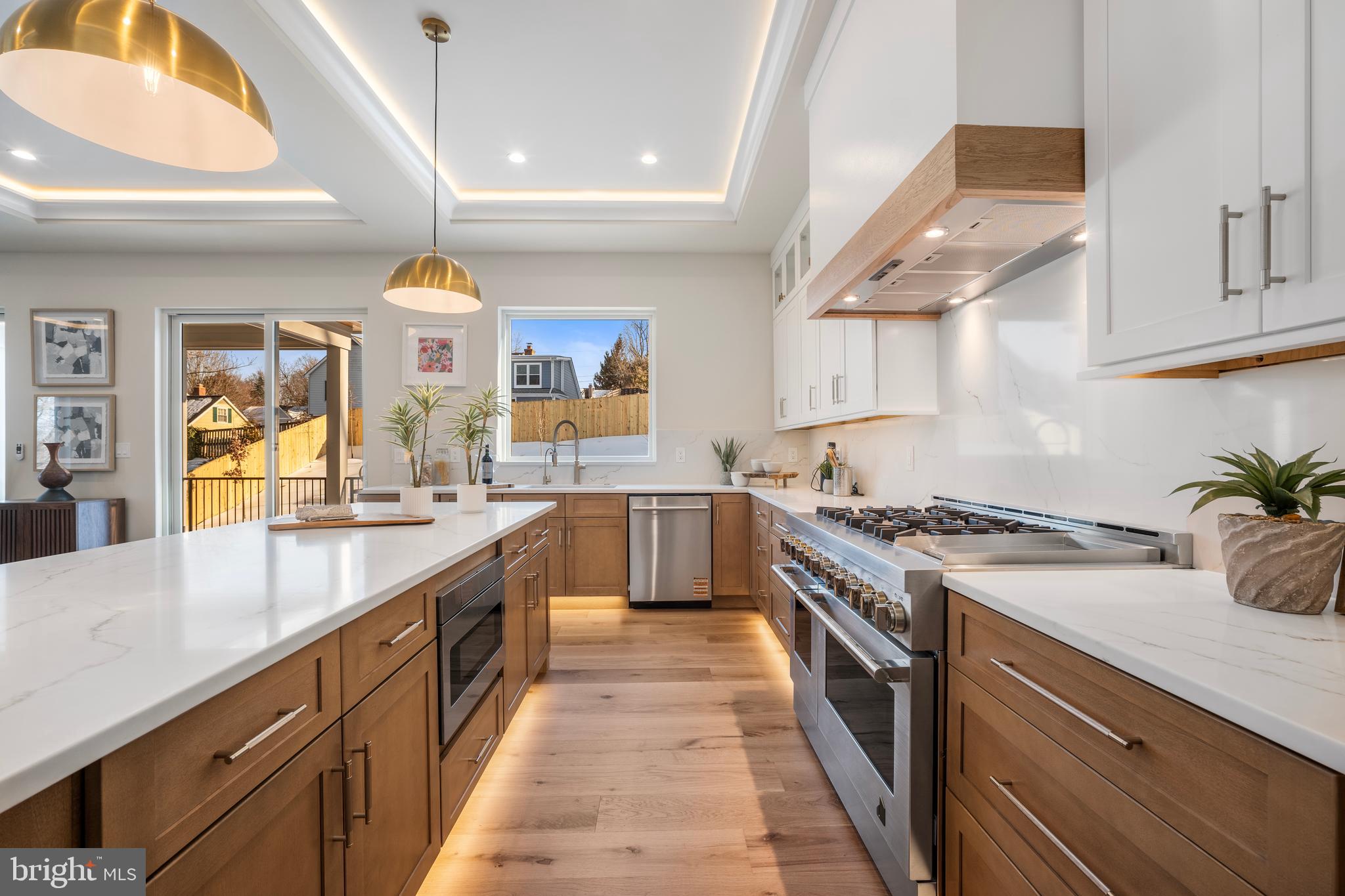 1935 Foxhall Road McLean, VA 22101 - Photo 33 of 80 a large kitchen with stainless steel appliances granite countertop a lot of counter space and a sink