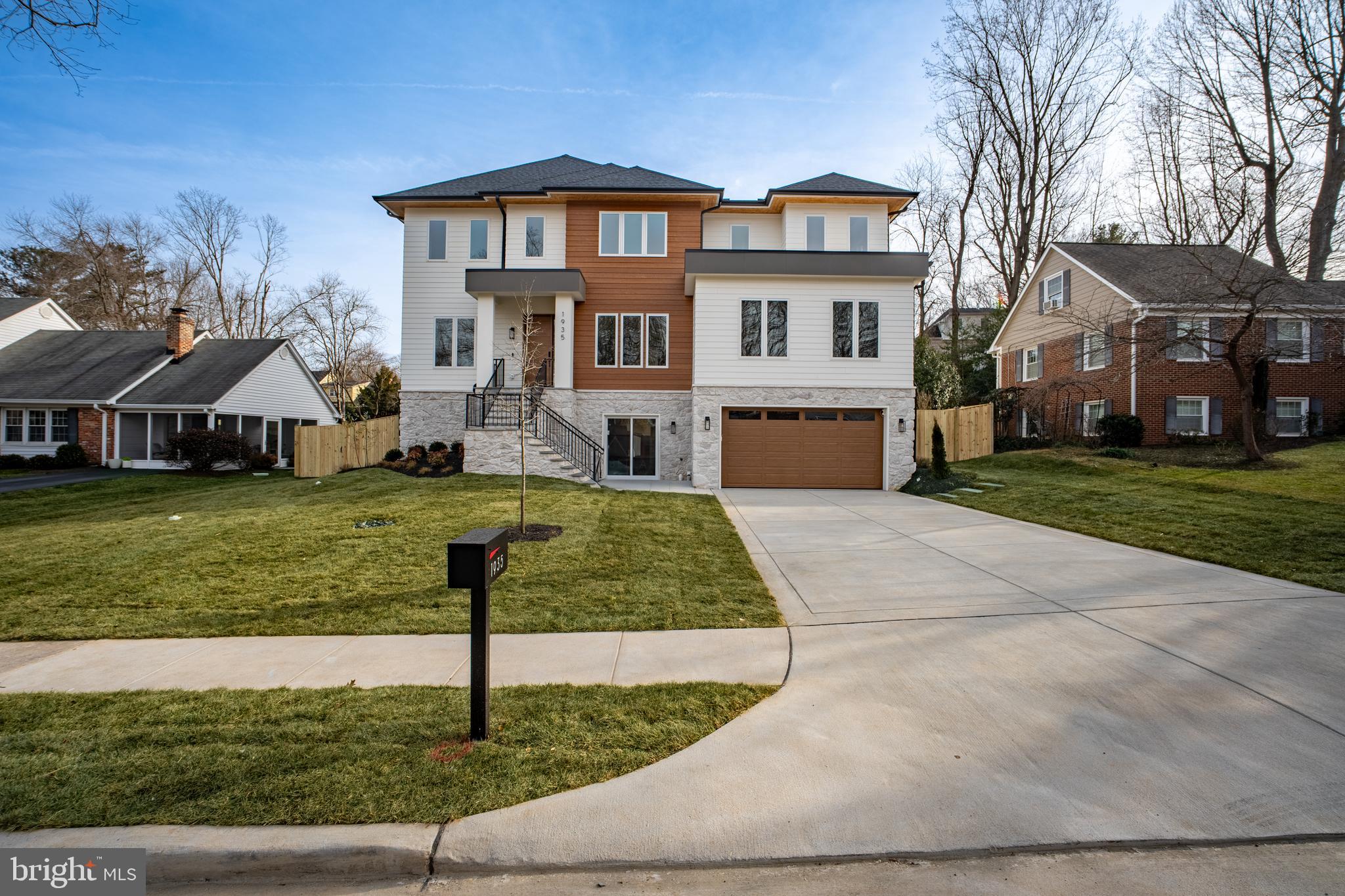 1935 Foxhall Road McLean, VA 22101 - Photo 4 of 80 a front view of a house with a yard