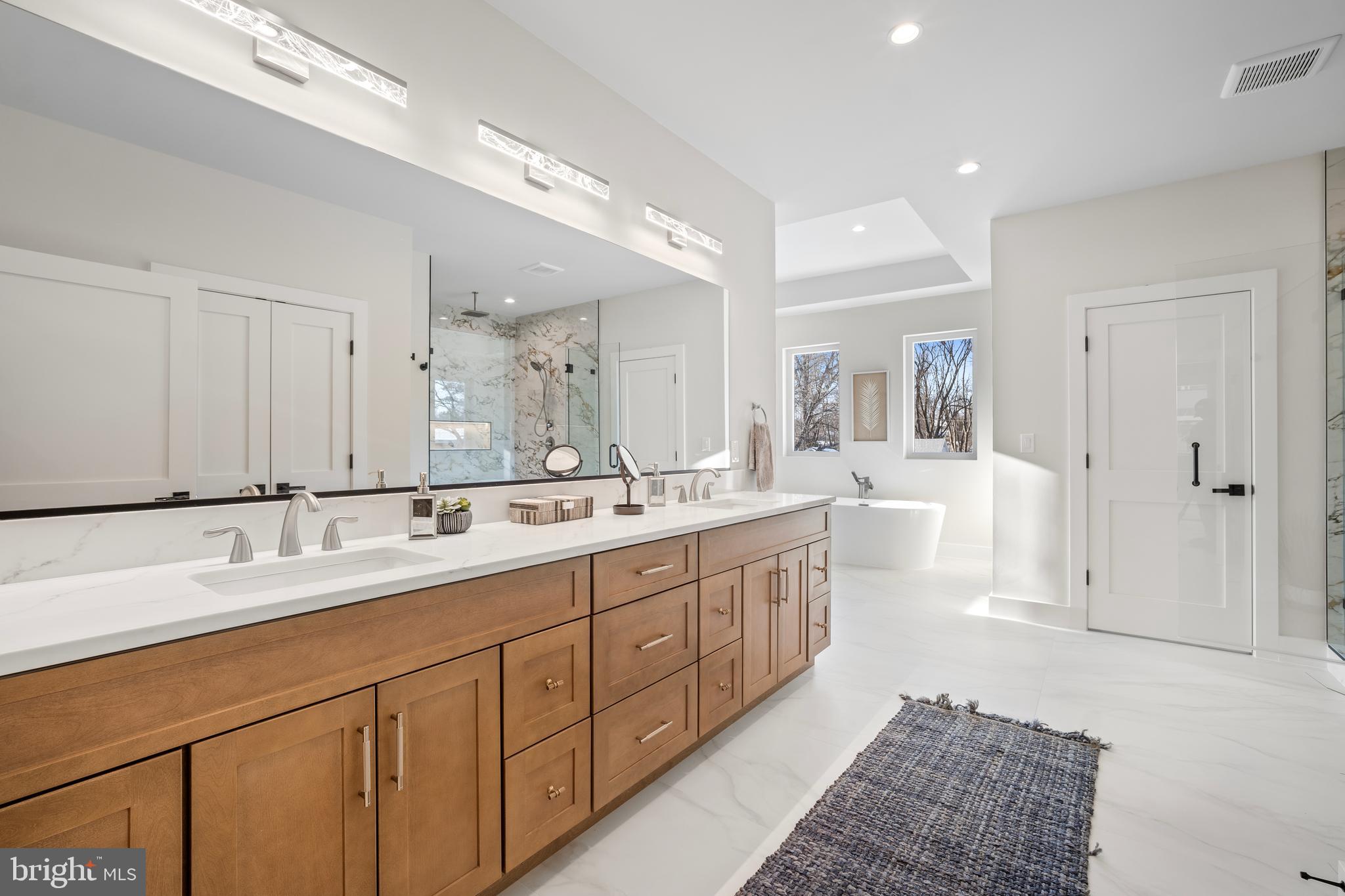 1935 Foxhall Road McLean, VA 22101 - Photo 46 of 80 a spacious bathroom with a double vanity sink mirror and