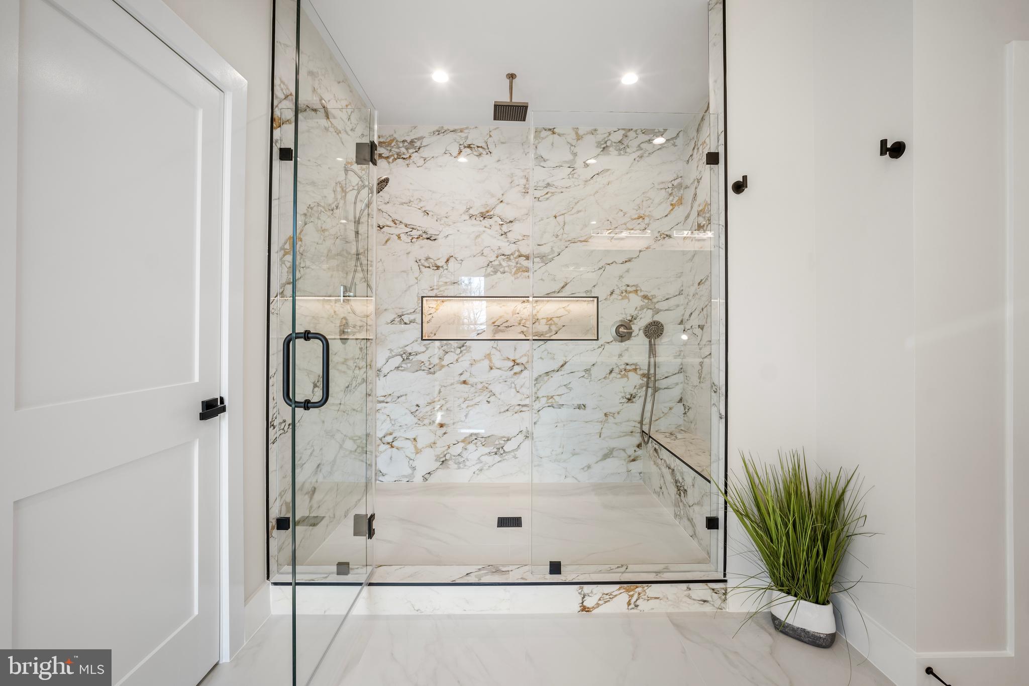 1935 Foxhall Road McLean, VA 22101 - Photo 47 of 80 a bathroom with a bathtub and a shower