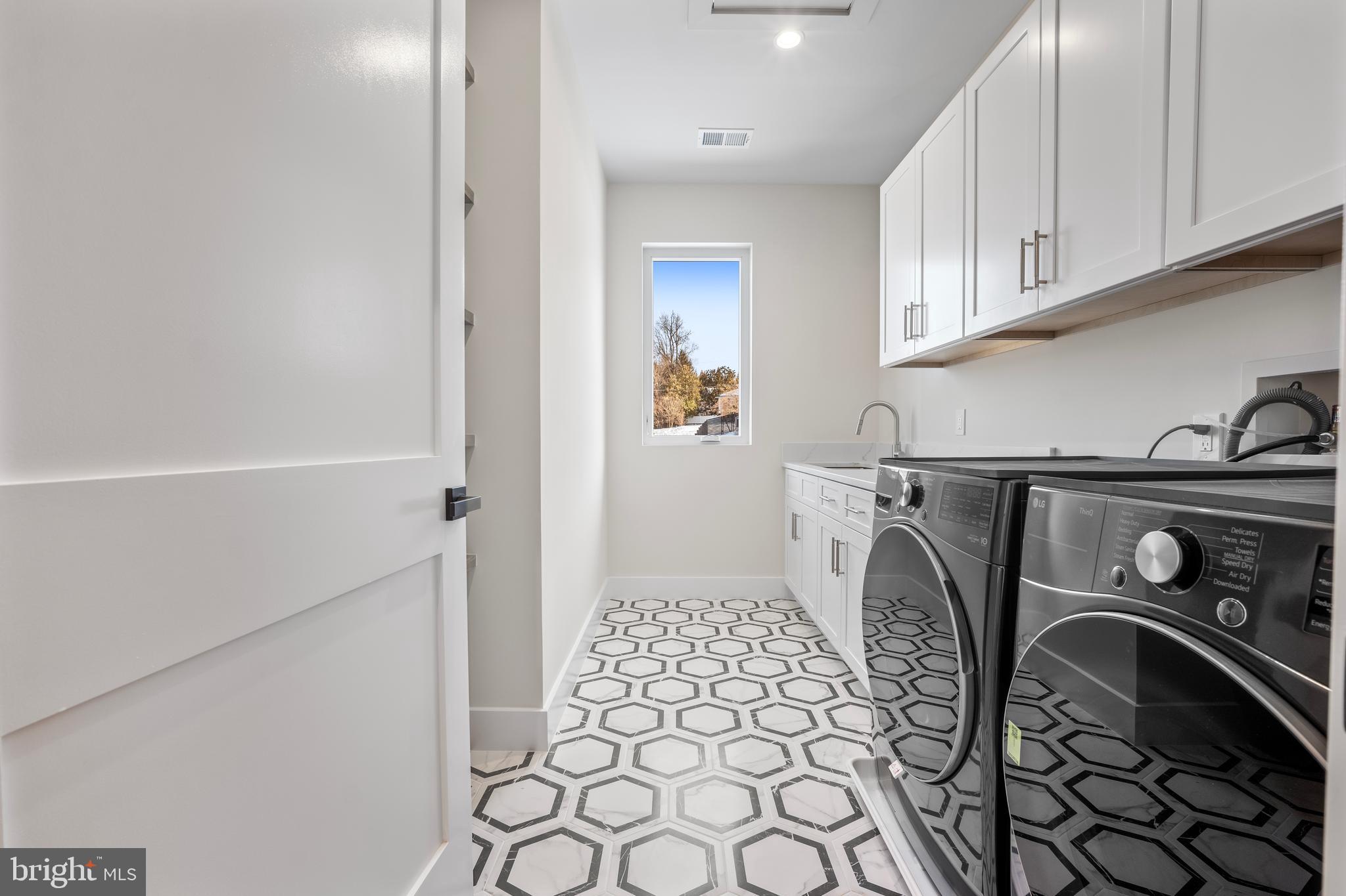 1935 Foxhall Road McLean, VA 22101 - Photo 50 of 80 a utility room with dryer and washer