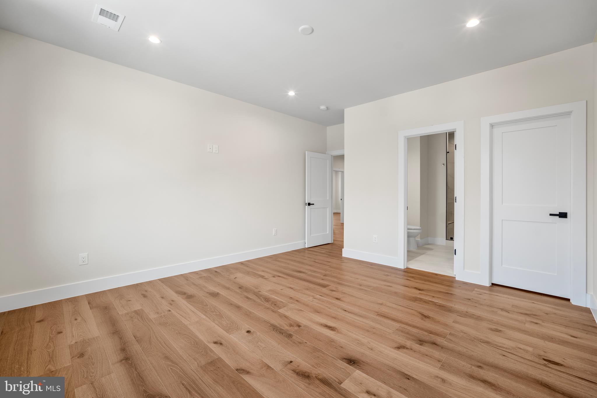1935 Foxhall Road McLean, VA 22101 - Photo 55 of 80 a view of an empty room with wooden floor and closet