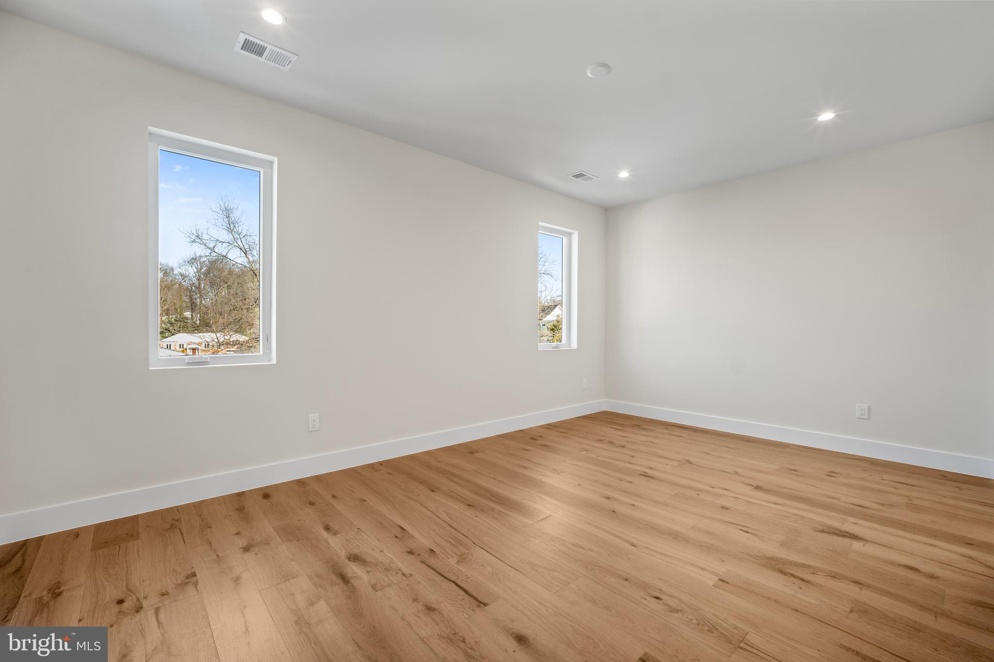 1935 Foxhall Road McLean, VA 22101 - Photo 57 of 80 a view of empty room with wooden floor and fan