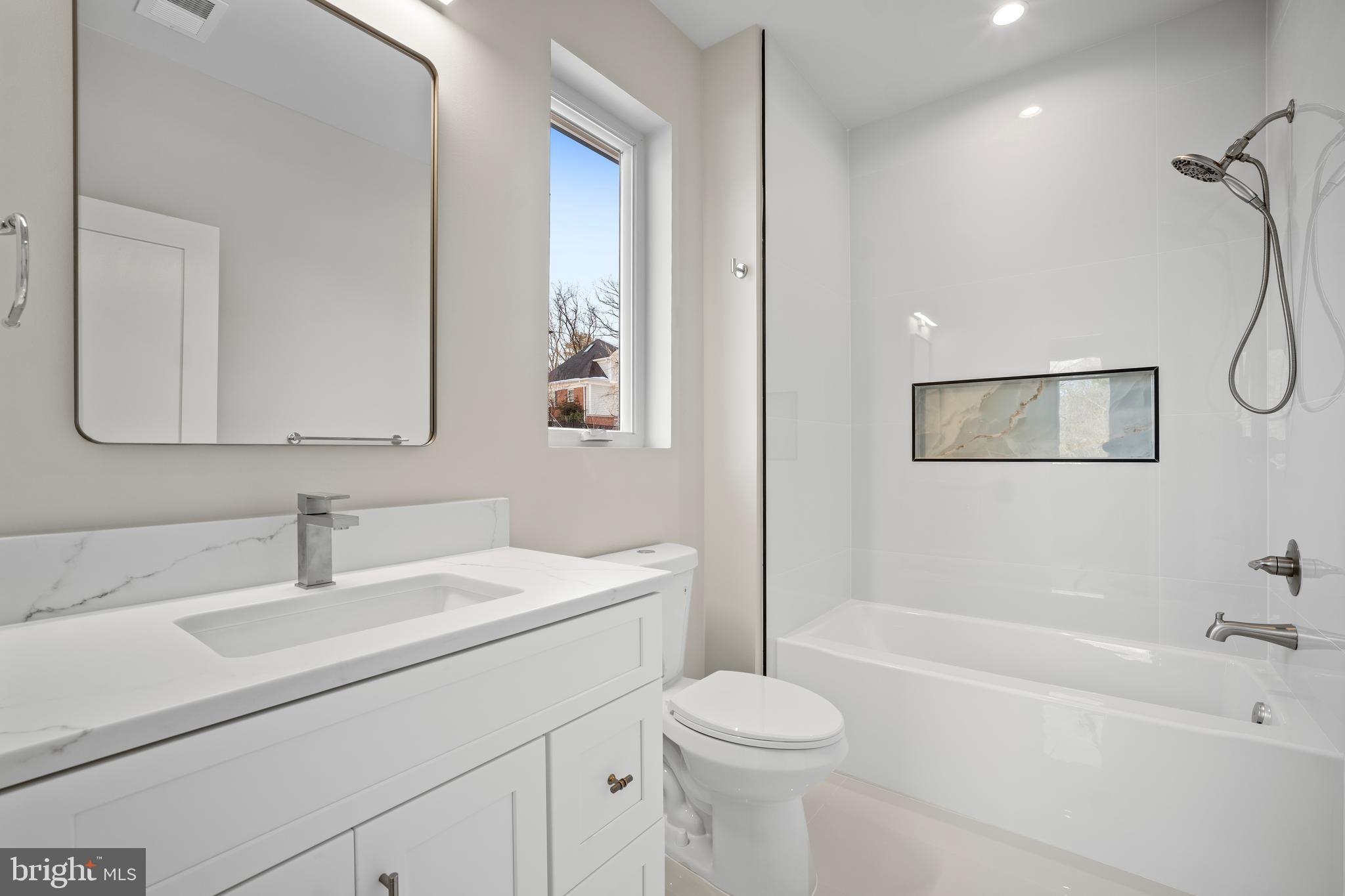 1935 Foxhall Road McLean, VA 22101 - Photo 59 of 80 a bathroom with a sink a toilet and shower