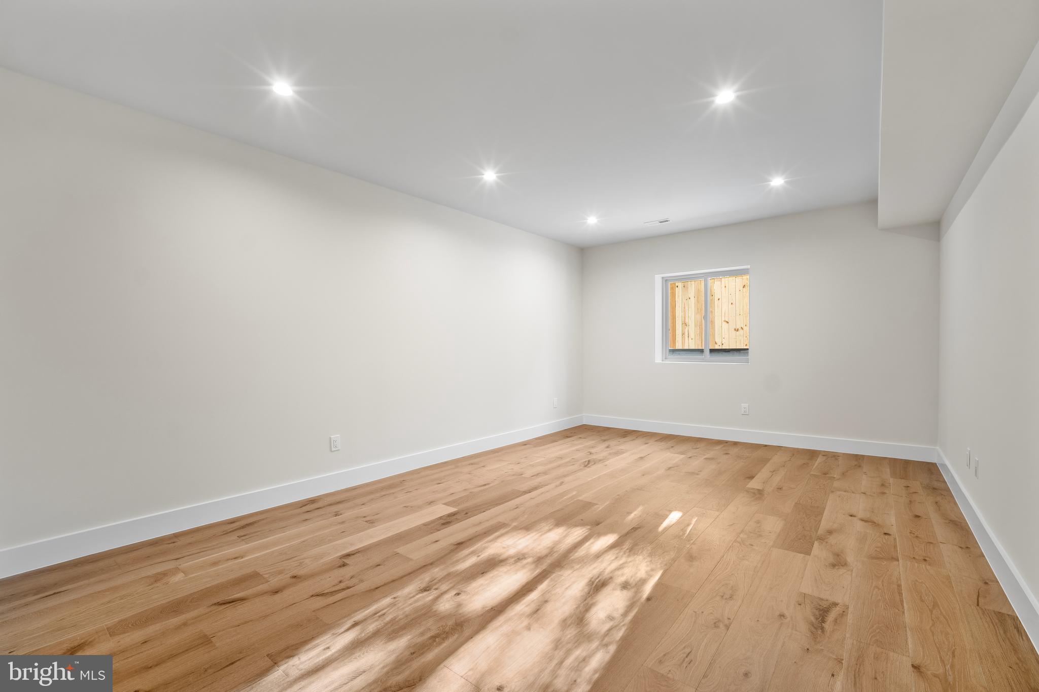 1935 Foxhall Road McLean, VA 22101 - Photo 63 of 80 an empty room with wooden floor and windows