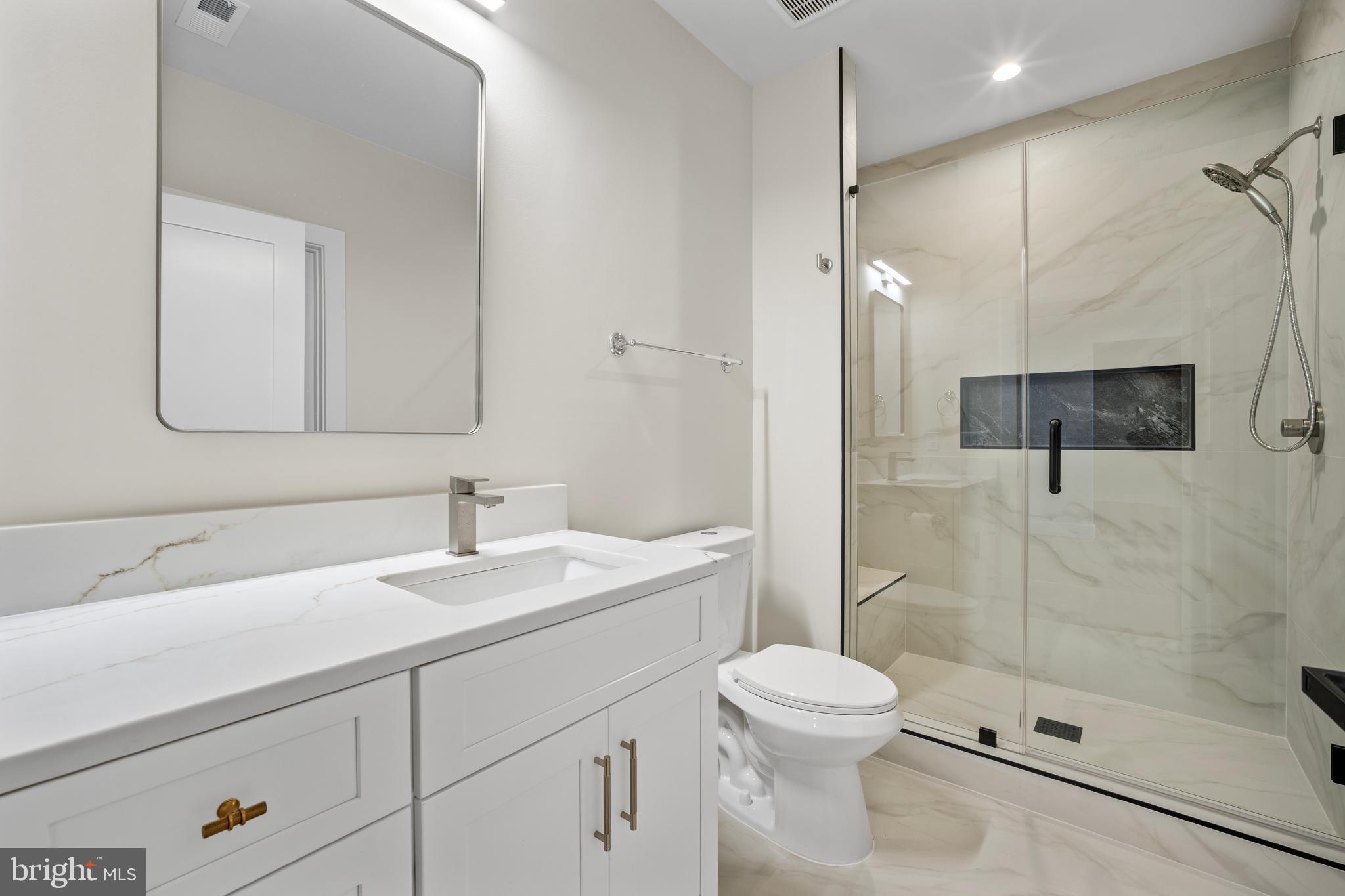 1935 Foxhall Road McLean, VA 22101 - Photo 67 of 80 a bathroom with a sink a toilet and shower