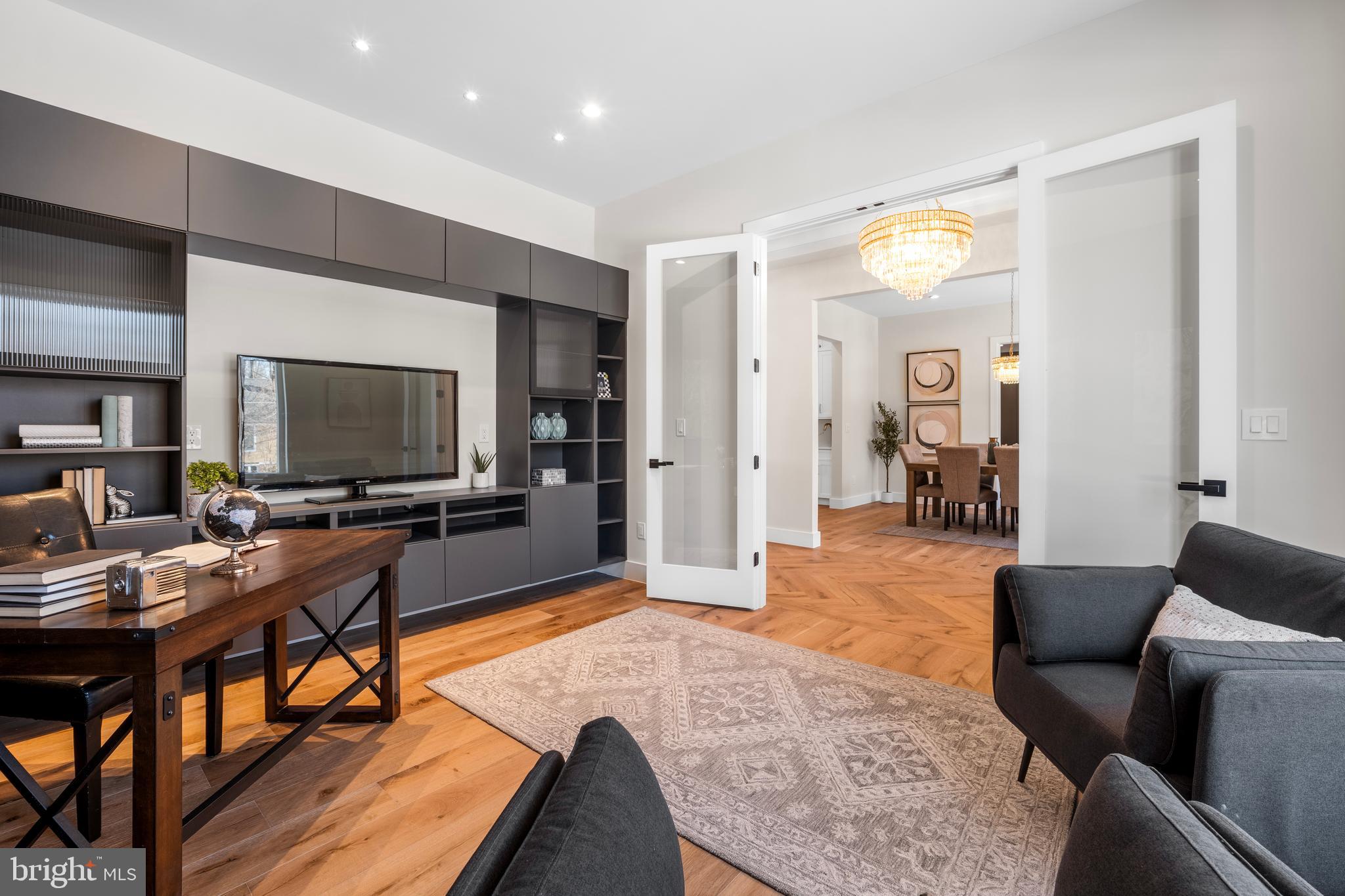 1935 Foxhall Road McLean, VA 22101 - Photo 9 of 80 a living room with furniture and a flat screen tv
