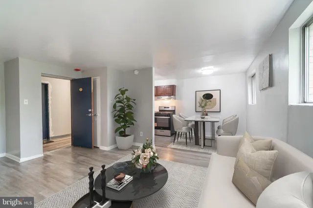 a living room with furniture and a table