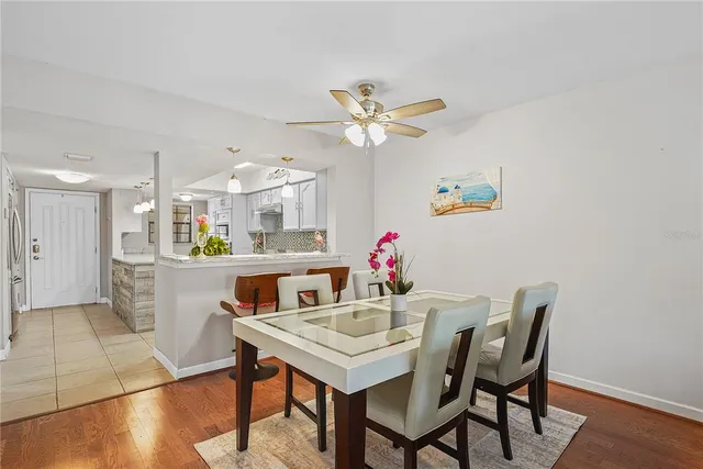 a view of a dining room with furniture and wooden floor