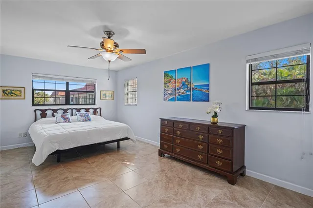 a living room with furniture and a baby crib