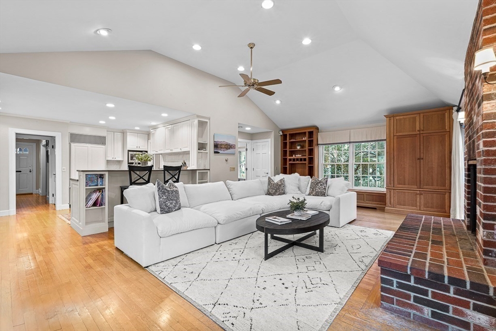 24 Garrison Road Wellesley, MA 02482 - Photo 13 of 32 a living room with furniture kitchen view and a large window