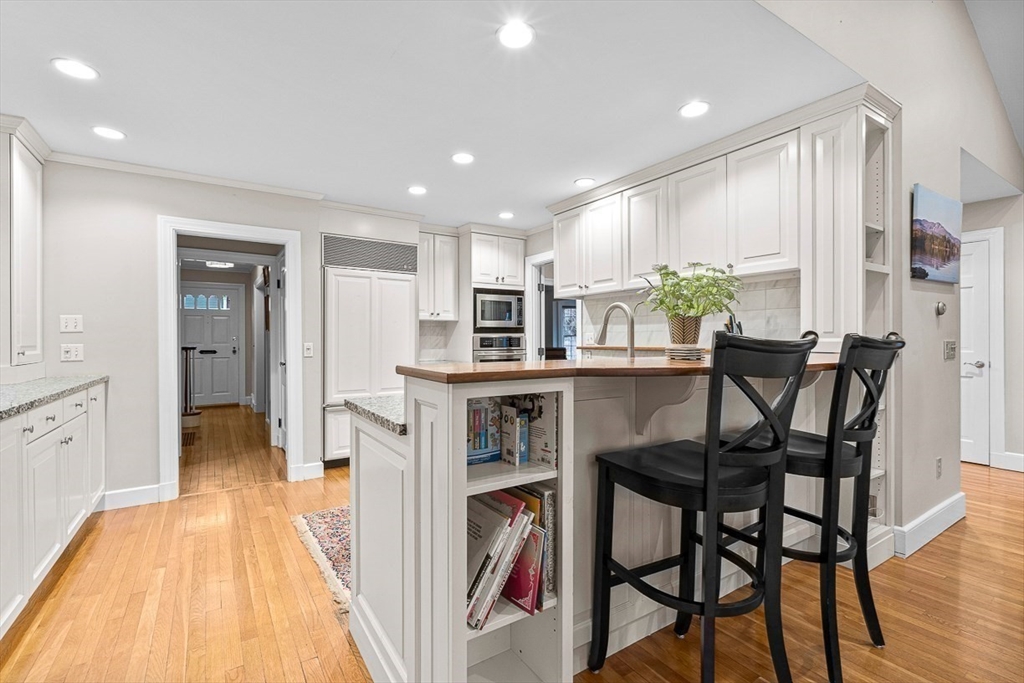 24 Garrison Road Wellesley, MA 02482 - Photo 14 of 32 a dining room with furniture and a floor to ceiling window