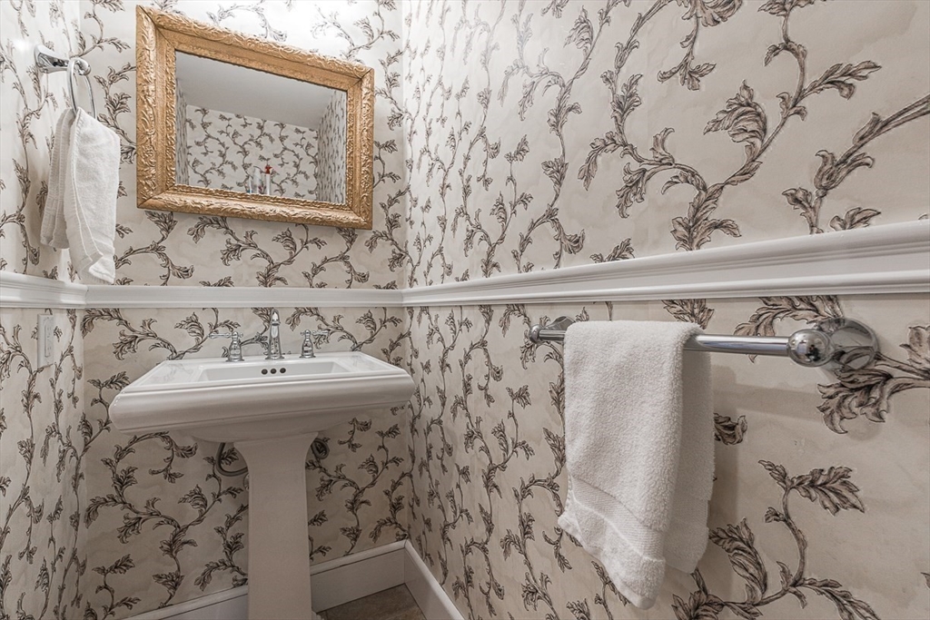 24 Garrison Road Wellesley, MA 02482 - Photo 18 of 32 a bathroom with a sink and mirror