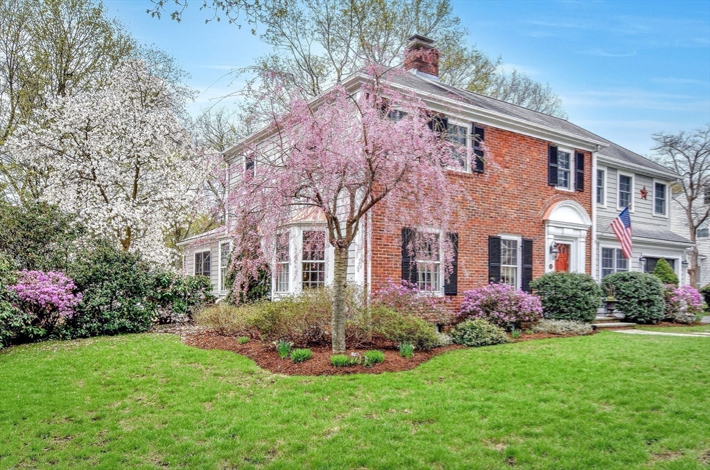 24 Garrison Road Wellesley, MA 02482 - Photo 2 of 32 a front view of house with yard and green space
