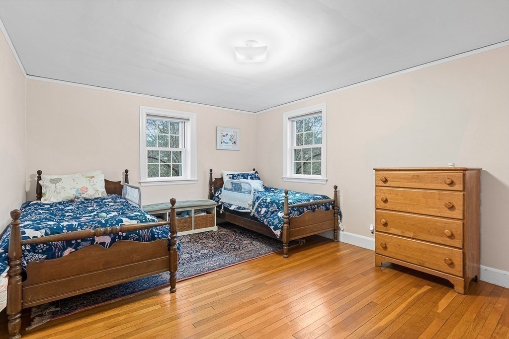 24 Garrison Road Wellesley, MA 02482 - Photo 24 of 32 a bedroom with a bed and a window