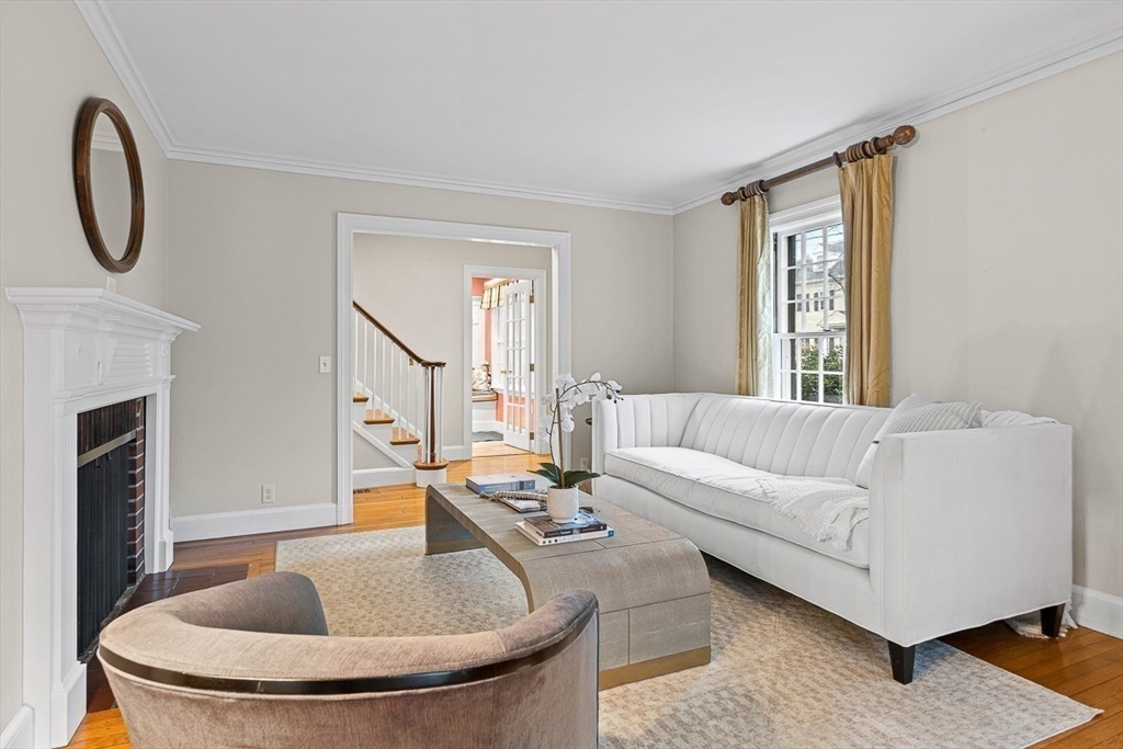 24 Garrison Road Wellesley, MA 02482 - Photo 4 of 32 a living room with furniture and a fireplace