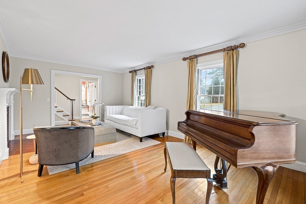 24 Garrison Road Wellesley, MA 02482 - Photo 6 of 32 a living room with furniture and a wooden floor