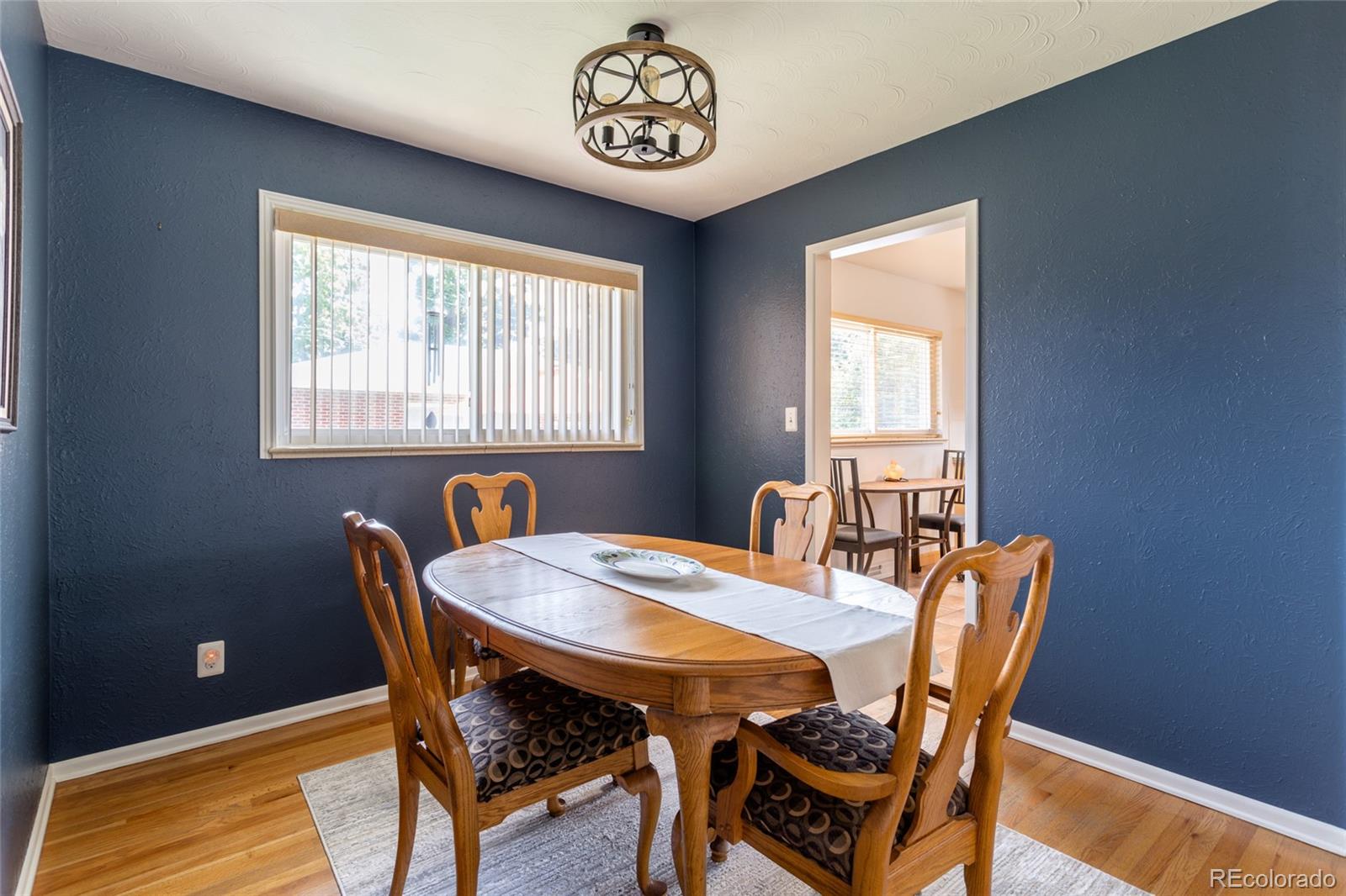 4530 South Inca Street Englewood, CO 80110 - Photo 11 of 37 a view of a dining room with furniture and window