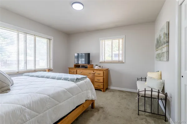 a bedroom with a bed and a table in it