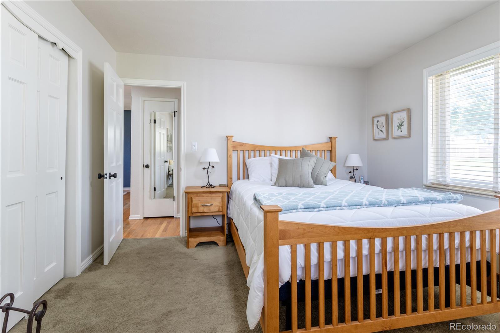 4530 South Inca Street Englewood, CO 80110 - Photo 17 of 37 a bedroom with a bed and a table
