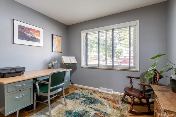 a workspace with furniture and a window