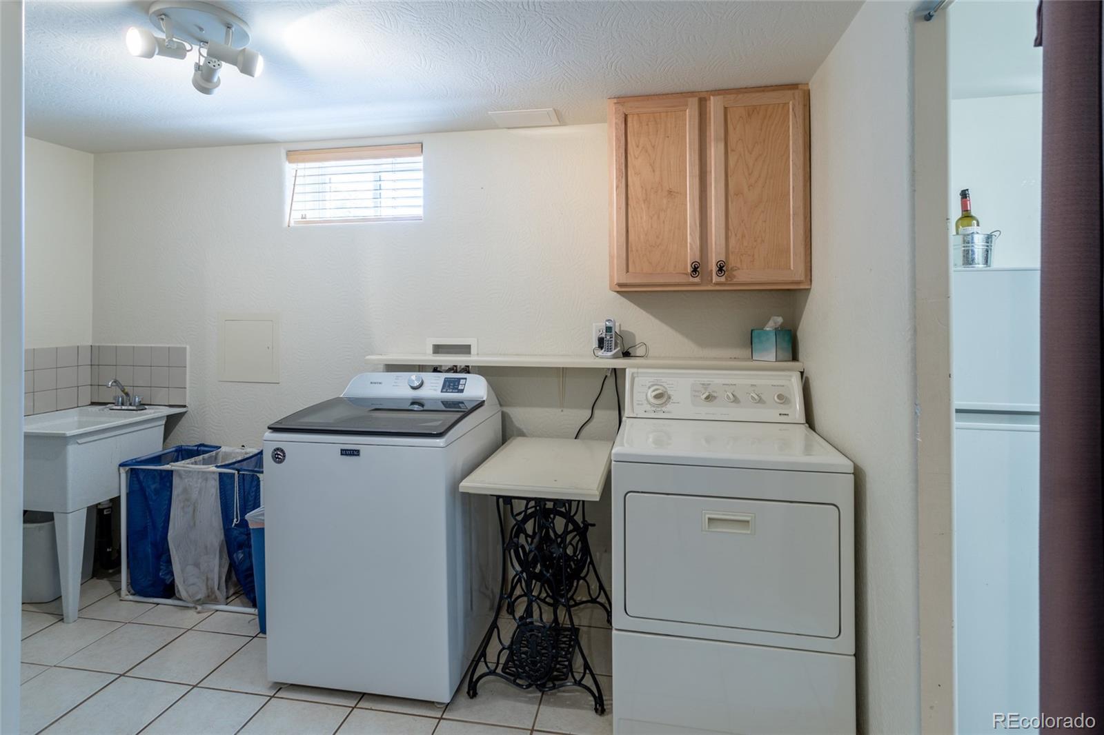 4530 South Inca Street Englewood, CO 80110 - Photo 30 of 37 a utility room with dryer and washer